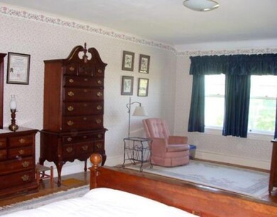 Master bedroom with front sitting area.