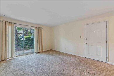Living room with walkout to patio.