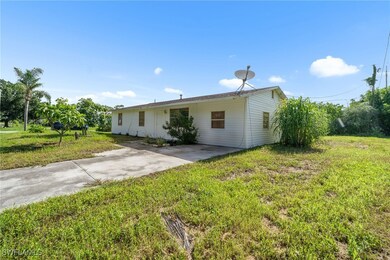 View of front of house featuring concrete driveway