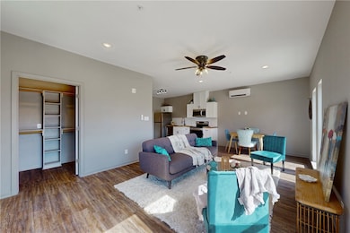 Living area with bas mounted air conditioner, rece