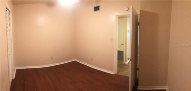 2nd bedroom with large walk-in closet and hardwood