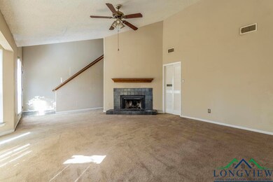 Unfurnished living room with a textured ceiling, c