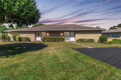 Ranch-style house with a lawn