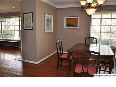 Dining room with crown molding!  French doors into