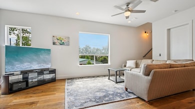 Living room featuring plenty of natural light, a 