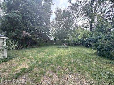 View of back yard fenced in and plenty of shade!