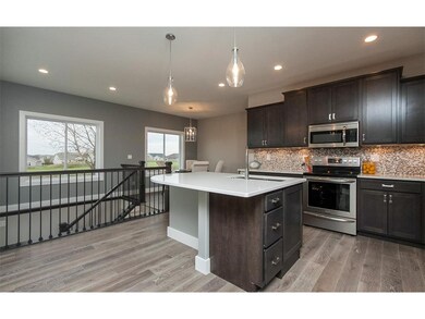 Kitchen - island, birch cabinets, quartz tops, til