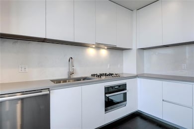 Kitchen featuring stainless steel appliances, whi