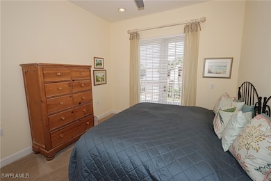 Carpeted bedroom featuring baseboards, a ceiling fan, and recessed lighting