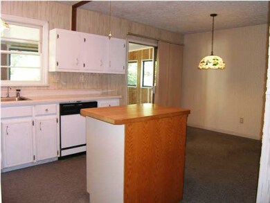 LOOKING INTO THE KITCHEN/HEARTH FROM THE FORMAL DI