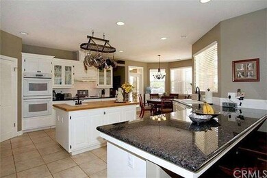 Ã¢â‚¬Â¢Granite counters in kitchen, white cabinets