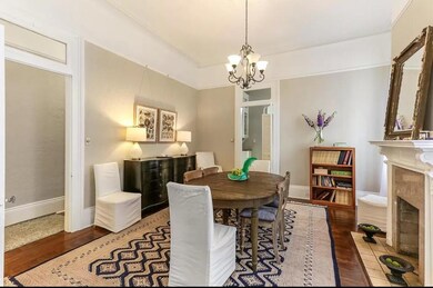 Spacious dining room with fireplace and chandelier