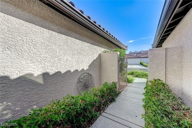 View of side of property featuring stucco siding a