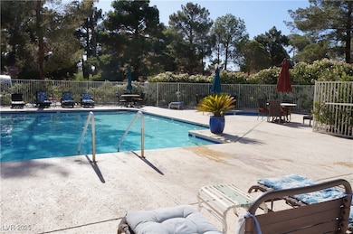 Community pool and hot-tub featuring a patio area