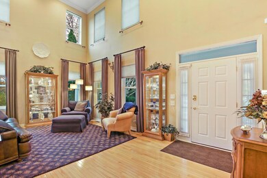 Lovely 2 story living room and hardwood floors