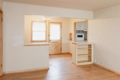 Kitchen featuring light wood-style floors, white o