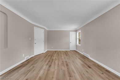 Spare room featuring light hardwood / wood-style floors