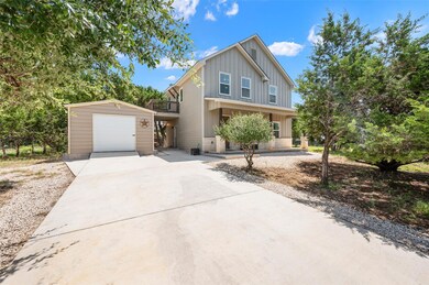 View of front of home featuring concrete driveway