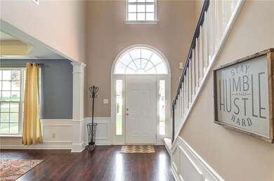 A grand entryway showcasing the handscraped wood flooring.