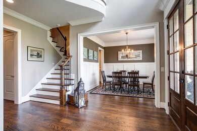 The spectacular wainscoting and eye-catching chandelier are clearly the focal point of this unbelievable room designed to elevate the art of dining to a new level.  
