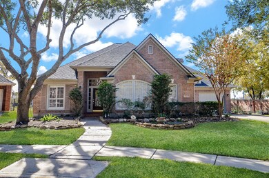Visually appealing landscaped front yard with ston