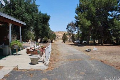 View to back lot, casita on left behind the main h