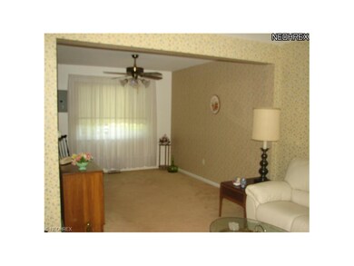 Dining area with ceiling fan and a full window tha