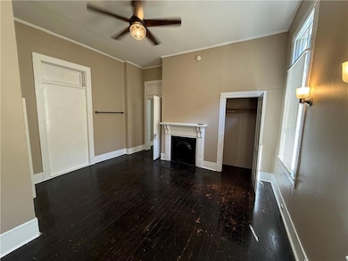 Unfurnished living room with a fireplace, a ceilin