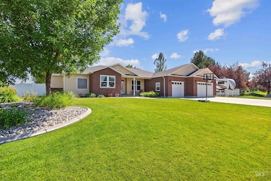Ranch-style home with a garage, brick siding, and concrete driveway