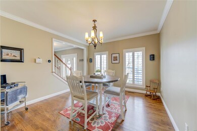 Dinning room with hardwood floors, plantation shut