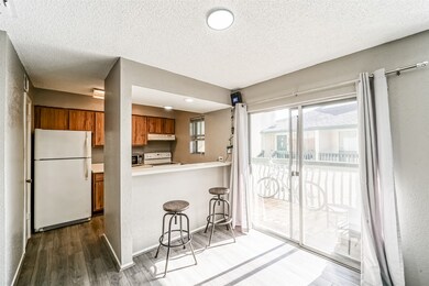 Featuring a dining area, a breakfast bar, and a ki