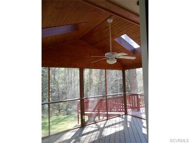 Enjoy the serenity of the large screened in porch 