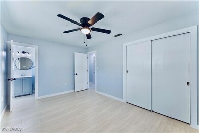 Unfurnished bedroom with a closet, baseboards, a s