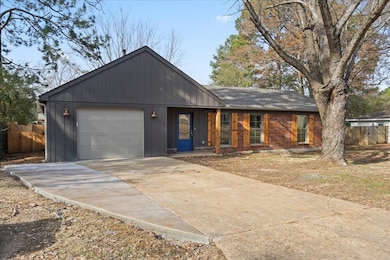Ranch-style home featuring a garage