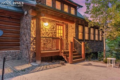 Exterior entry at dusk featuring a patio area