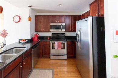 Well appointed kitchen with granite cabinets, bamb