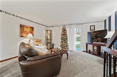The living room includes new carpeting and a slidi
