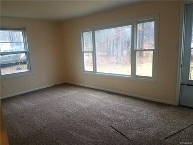 Living room. New paint and carpet all throughout t
