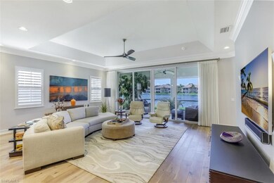 Great Room looking out to lanai and lake