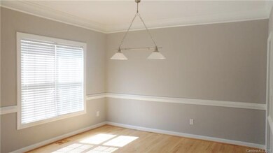 Formal Dining Room with wood floors and moldings.