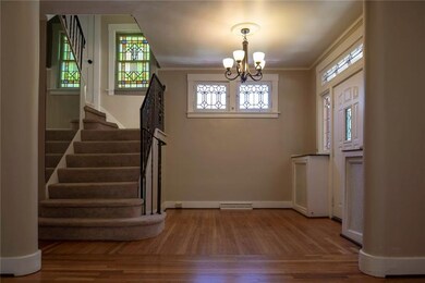 Grand entry with leaded stain glass windows...