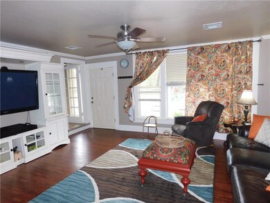 Living room angle from the dining area. TV console