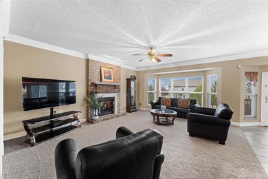 The great room has 9' ceilings, a gas fireplace, a