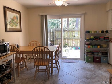 Dining area has new tile floors with sliding door