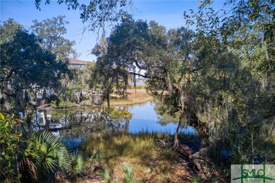 .51 Acres with draping live oak tree over the lago