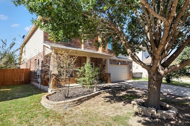 View of front of house with brick siding, drivewa