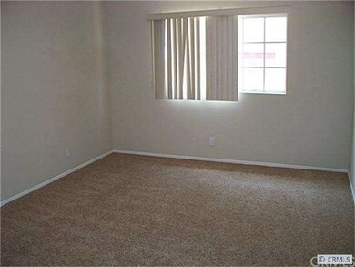 Bedroom 2, with new carpet and paint.