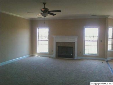 Gathering Room: Enjoy the feel of this home's wood burning fireplace as the center of entertainment.