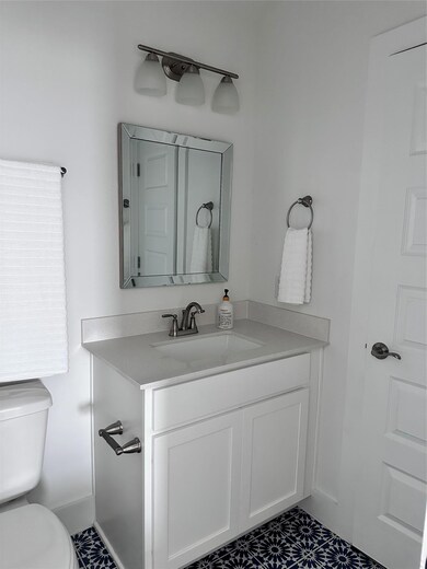 Bathroom with vanity and toilet