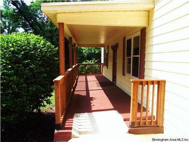 Cozy covered front porch right off the driveway.